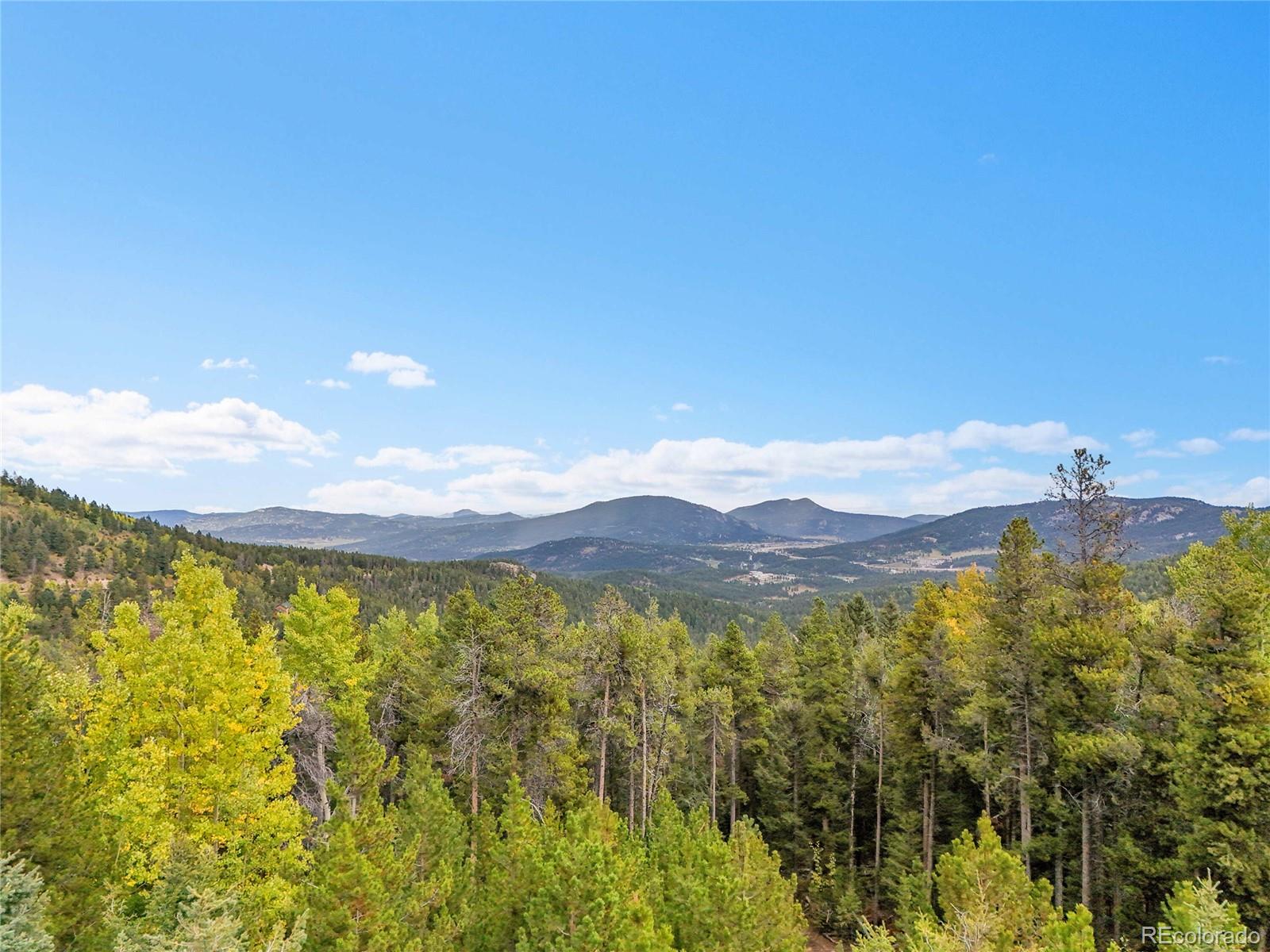 11333 Conifer Mountain Road Conifer, CO 80433 - Photo 7 of 50 a view of an aerial view of residential houses with outdoor space and mountain view