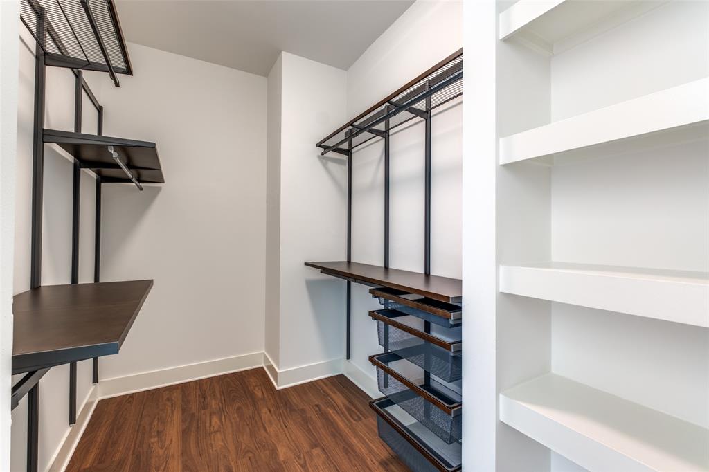 3611 Congress Avenue, Unit 2103 Dallas, TX 75219 - Photo 11 of 25 a view of walk in closet with clothes and shoes
