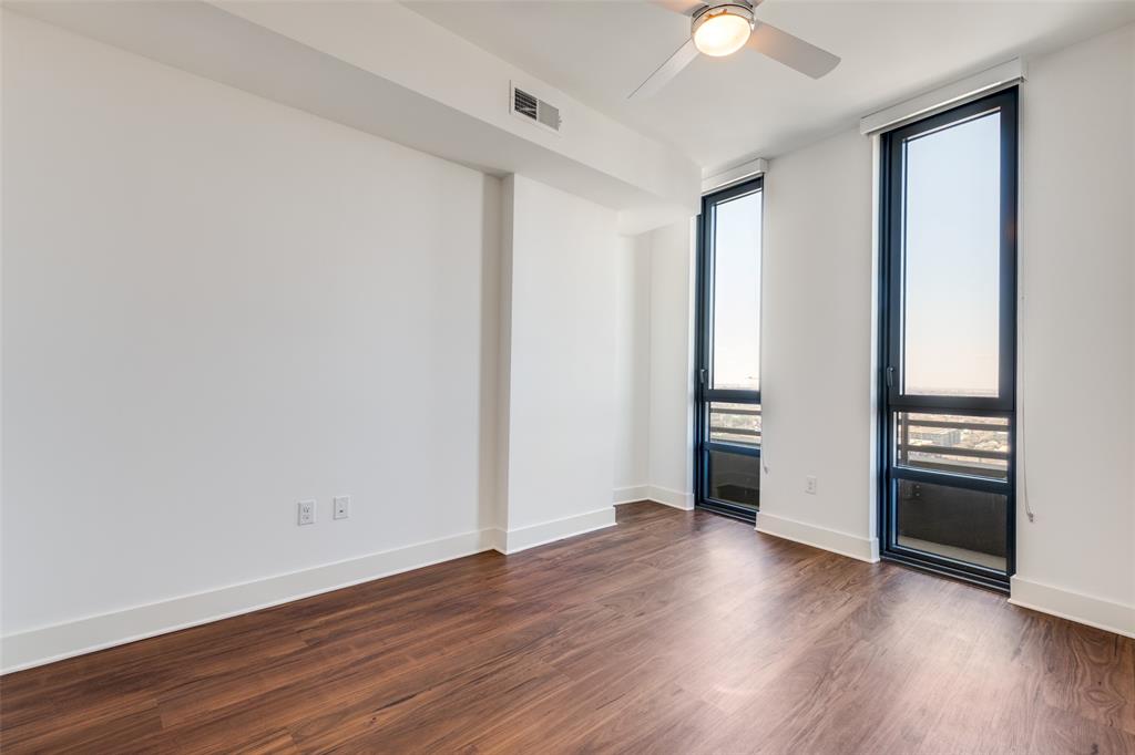 3611 Congress Avenue, Unit 2103 Dallas, TX 75219 - Photo 15 of 25 a view of an empty room with wooden floor