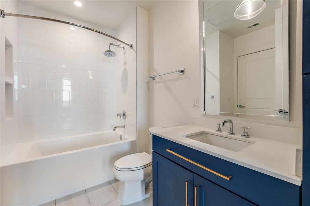 3611 Congress Avenue, Unit 2103 Dallas, TX 75219 - Photo 16 of 25 a bathroom with a sink a toilet and a bathtub