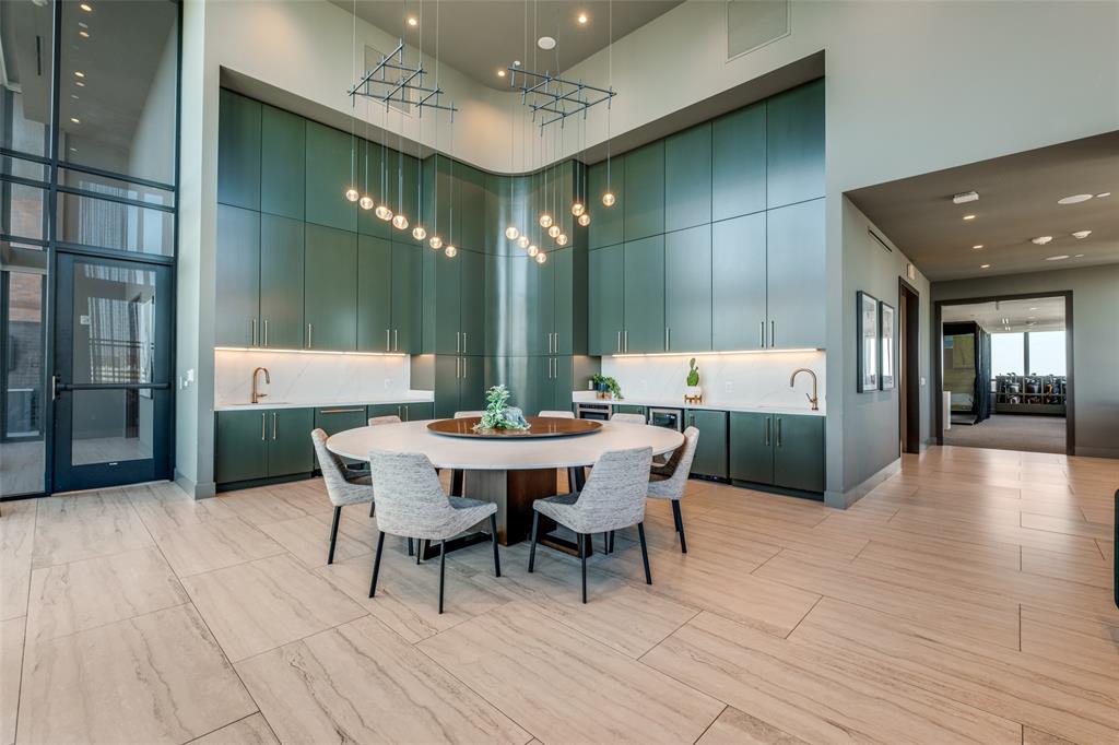 3611 Congress Avenue, Unit 2103 Dallas, TX 75219 - Photo 19 of 25 a outdoor dining space with furniture and wooden floor