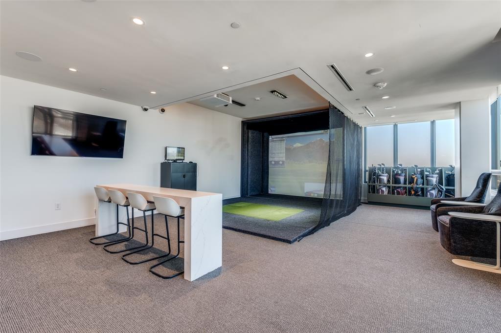 3611 Congress Avenue, Unit 2103 Dallas, TX 75219 - Photo 20 of 25 a view of a livingroom with furniture and a flat screen tv