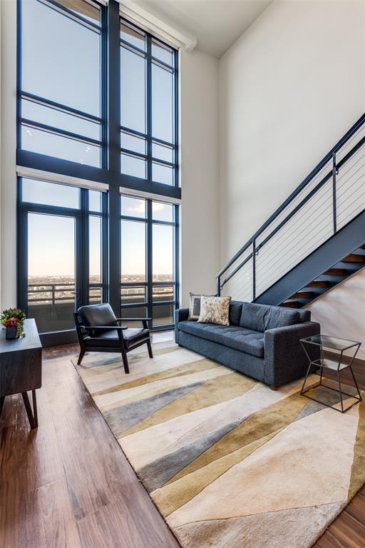 3611 Congress Avenue, Unit 2103 Dallas, TX 75219 - Photo 4 of 25 a living room with furniture and wooden floor