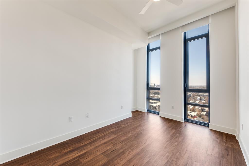 3611 Congress Avenue, Unit 2103 Dallas, TX 75219 - Photo 10 of 25 an empty room with wooden floor