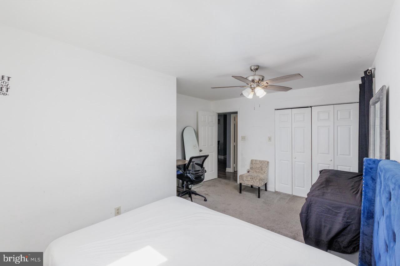 812 Silver Avenue Baltimore, MD 21221 - Photo 12 of 21 a living room with furniture and a chandelier