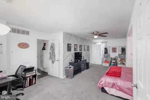 a bedroom with furniture and a chandelier