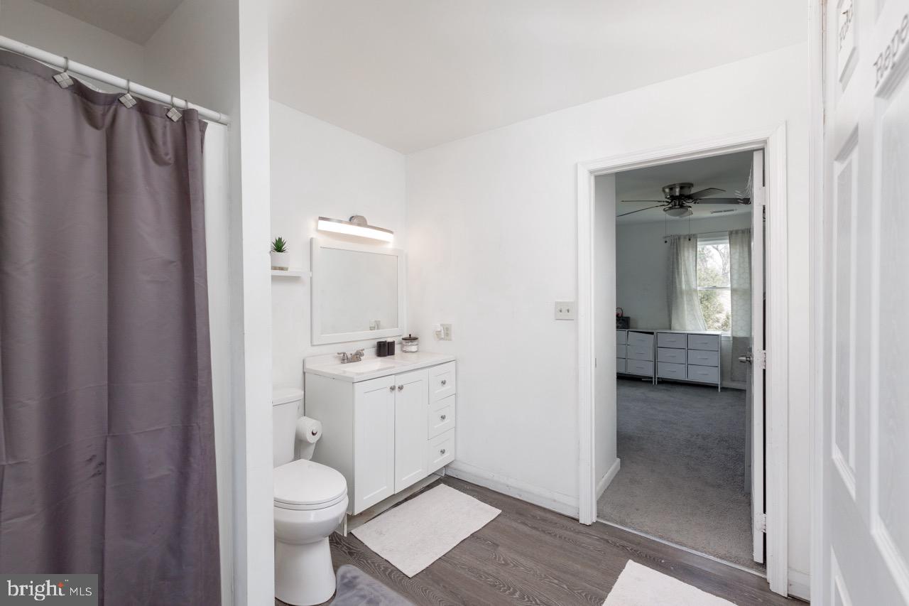 812 Silver Avenue Baltimore, MD 21221 - Photo 18 of 21 a bathroom with a toilet a sink and shower