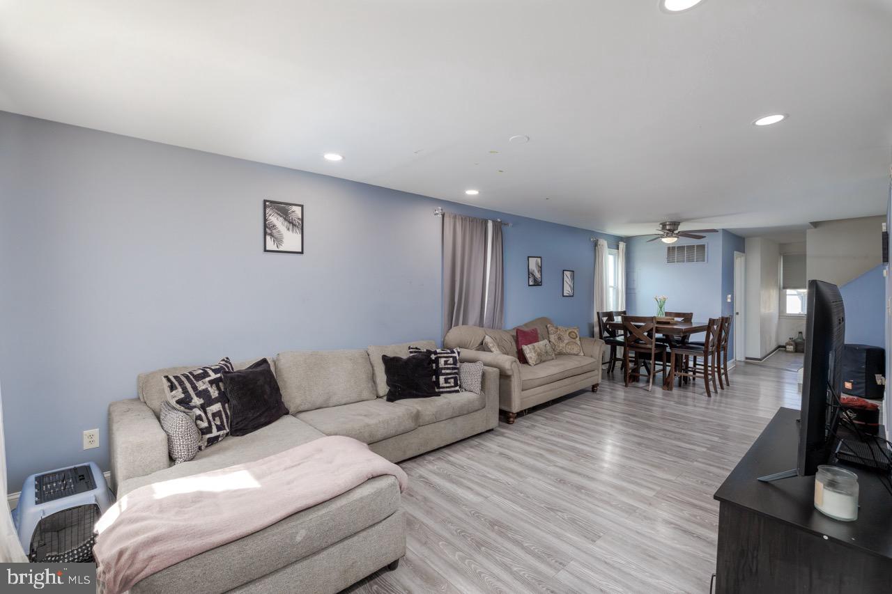 812 Silver Avenue Baltimore, MD 21221 - Photo 2 of 21 a living room with furniture and a wooden floor