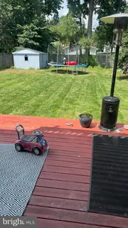 a view of a chairs and tables in the backyard