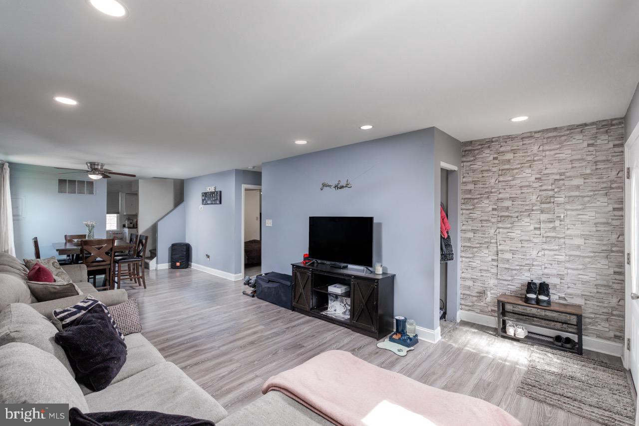 812 Silver Avenue Baltimore, MD 21221 - Photo 3 of 21 a living room with furniture and a flat screen tv