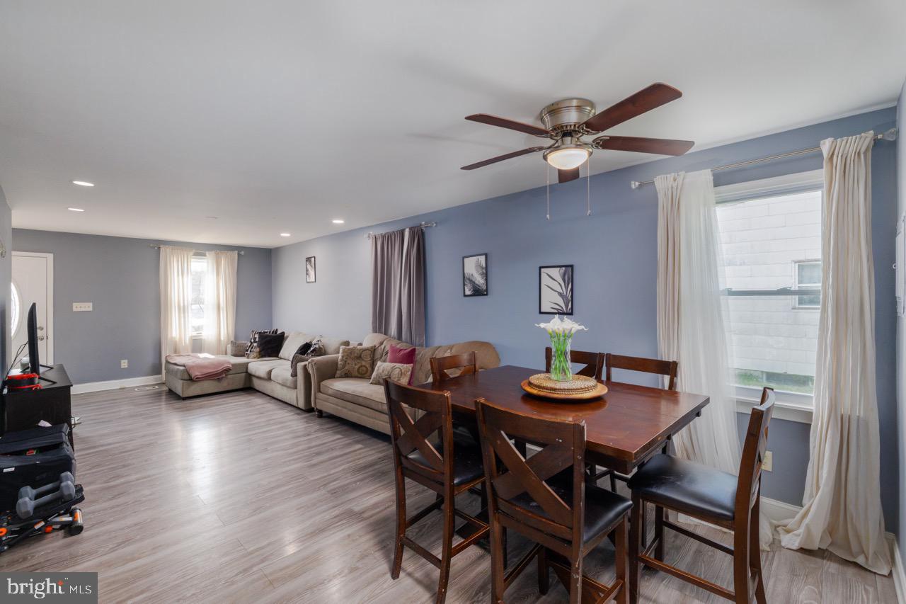 812 Silver Avenue Baltimore, MD 21221 - Photo 4 of 21 a view of a dining room with furniture and wooden floor