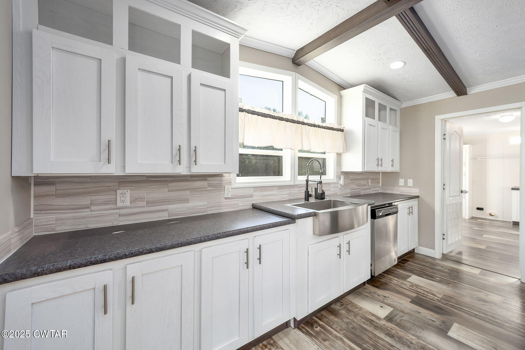 527 John Brown Road Beech Bluff, TN 38313 - Photo 11 of 28 a kitchen with granite countertop white cabinets and white appliances