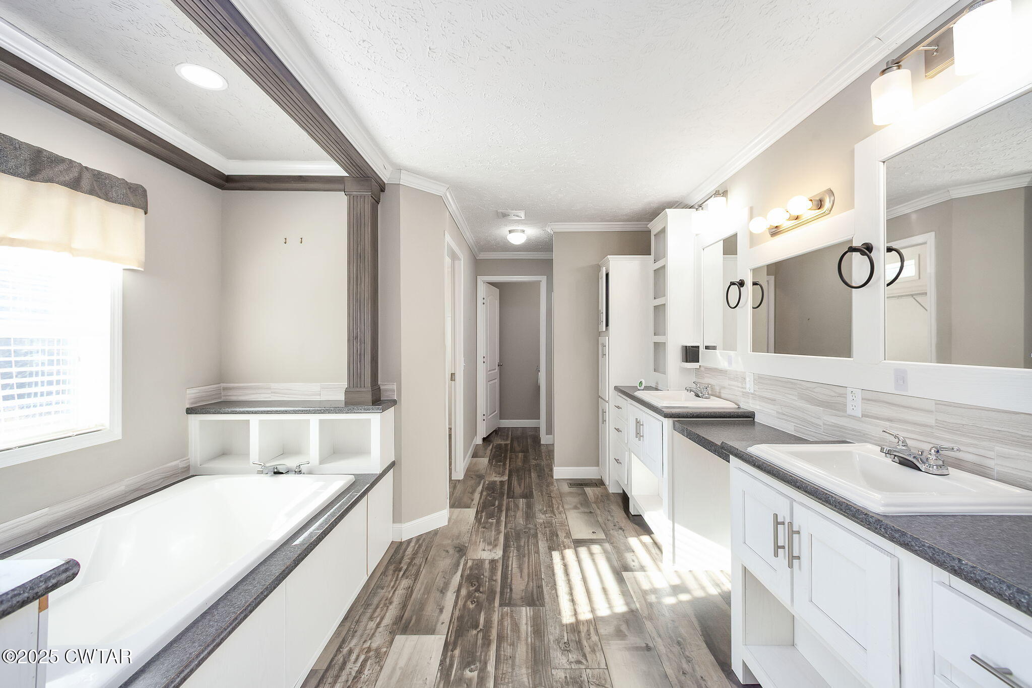 527 John Brown Road Beech Bluff, TN 38313 - Photo 15 of 28 a spacious bathroom with a granite countertop sink a large mirror and a bathtub