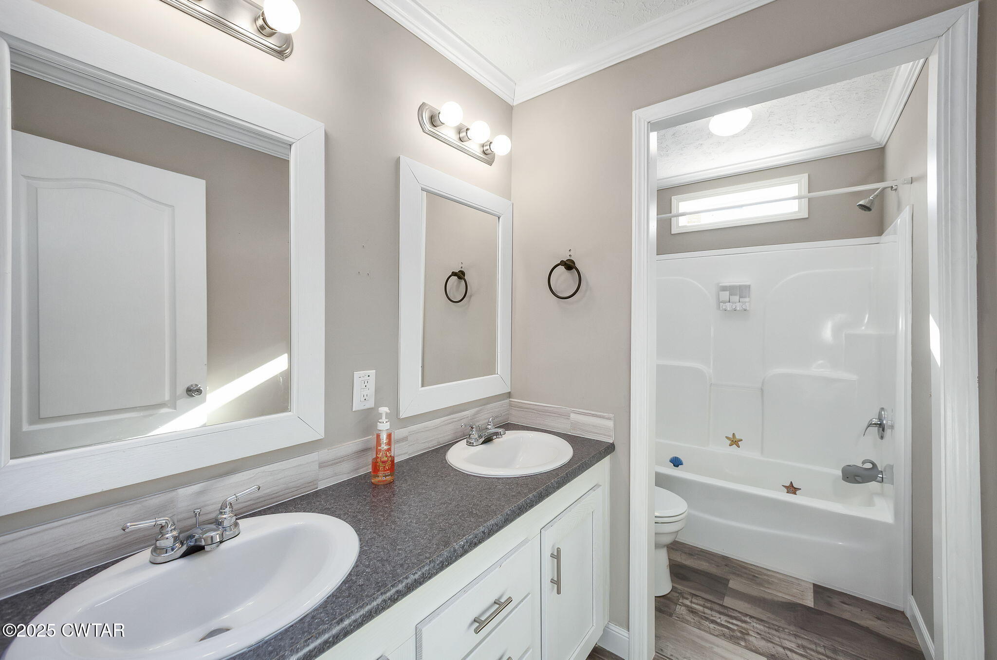 527 John Brown Road Beech Bluff, TN 38313 - Photo 19 of 28 a bathroom with a granite countertop tub sink double vanity and mirror
