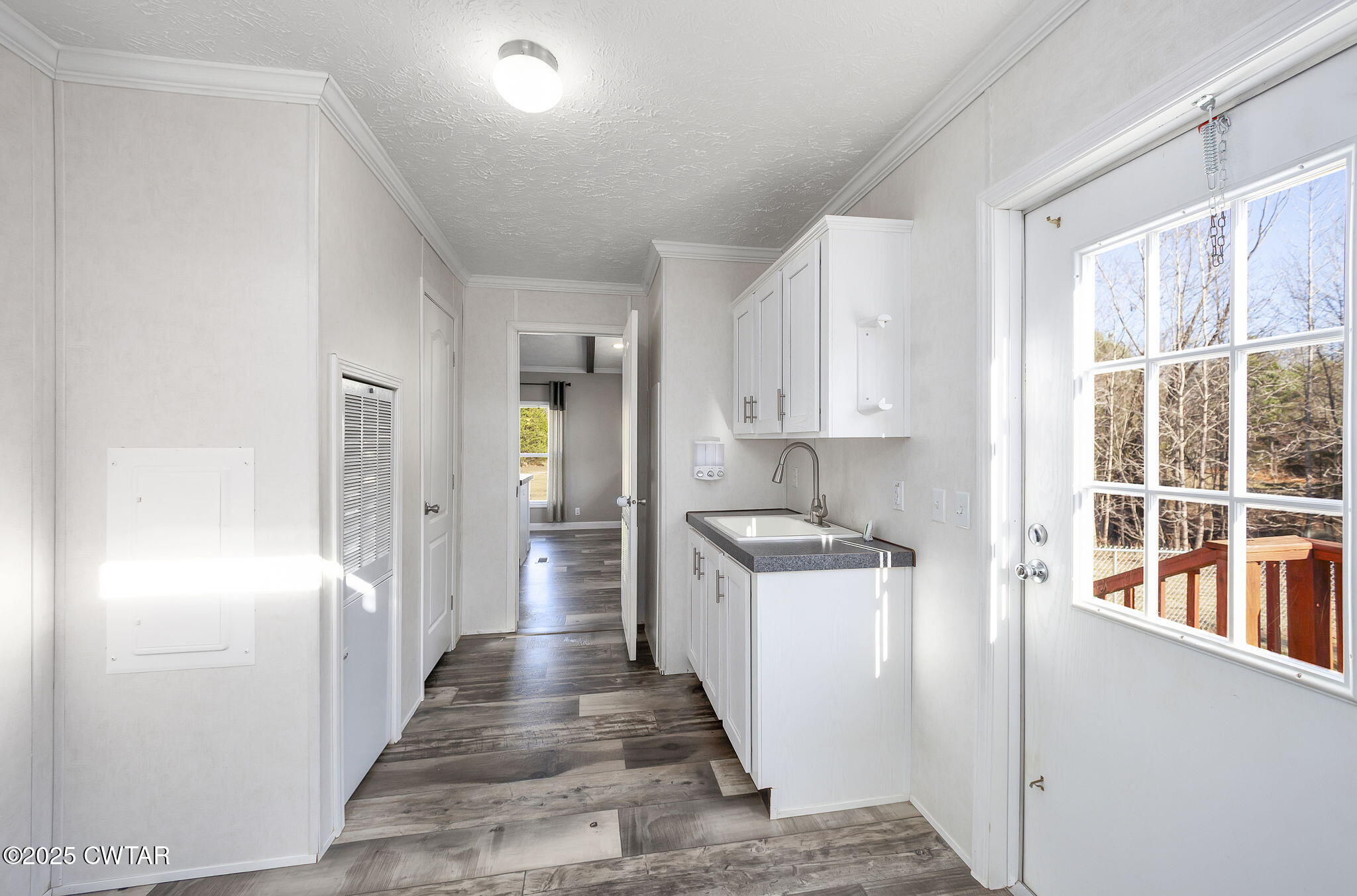 527 John Brown Road Beech Bluff, TN 38313 - Photo 21 of 28 a kitchen with stainless steel appliances kitchen island wooden cabinets and entryway