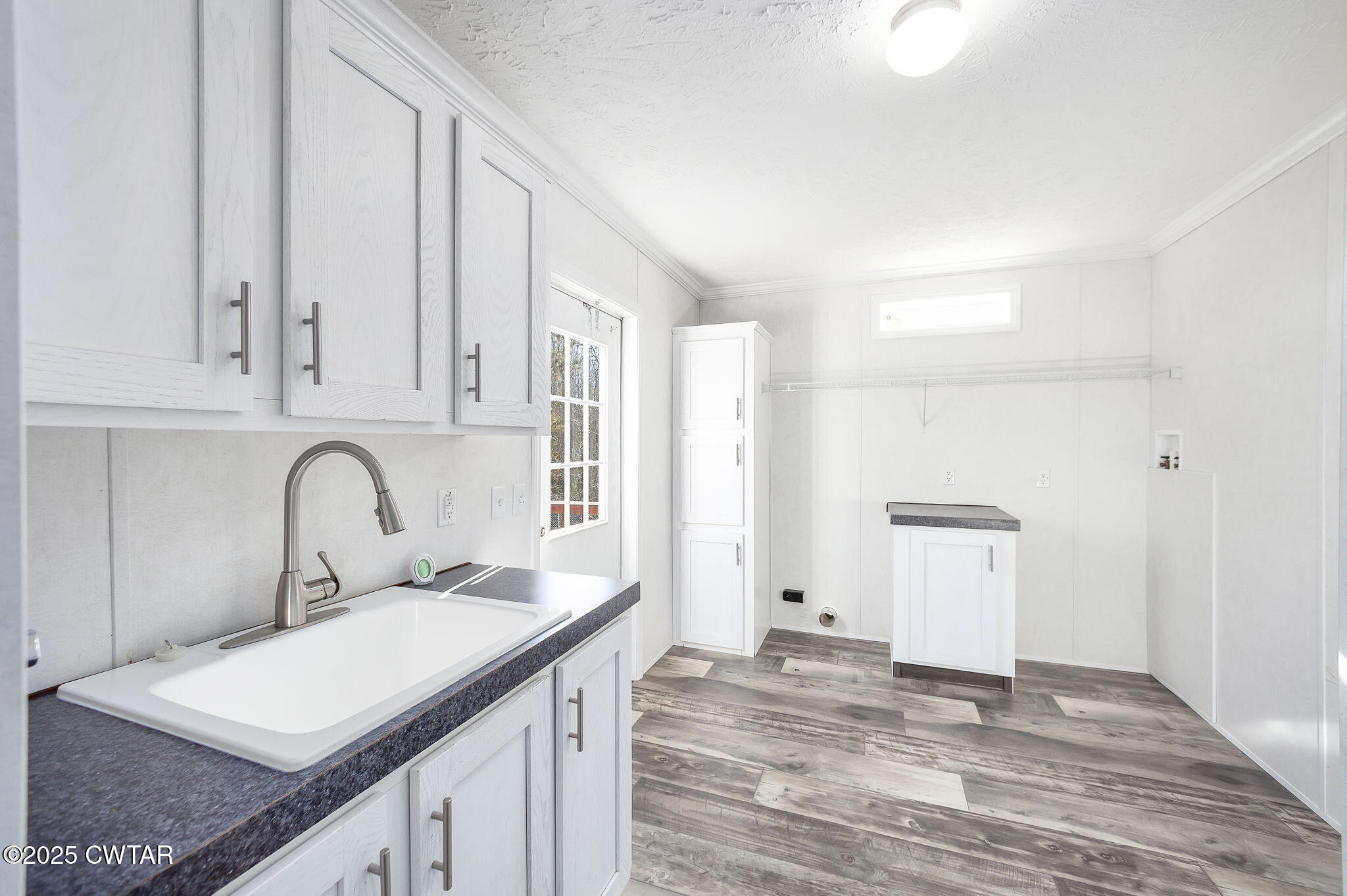 527 John Brown Road Beech Bluff, TN 38313 - Photo 22 of 28 a view of a kitchen sink and cabinets