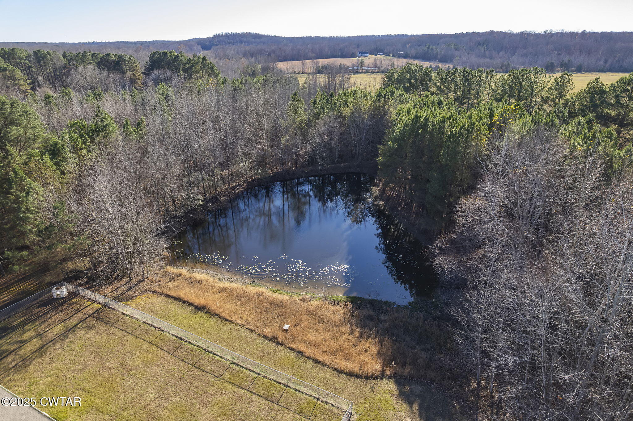 527 John Brown Road Beech Bluff, TN 38313 - Photo 27 of 28 a view of a lake with a mountain in the background