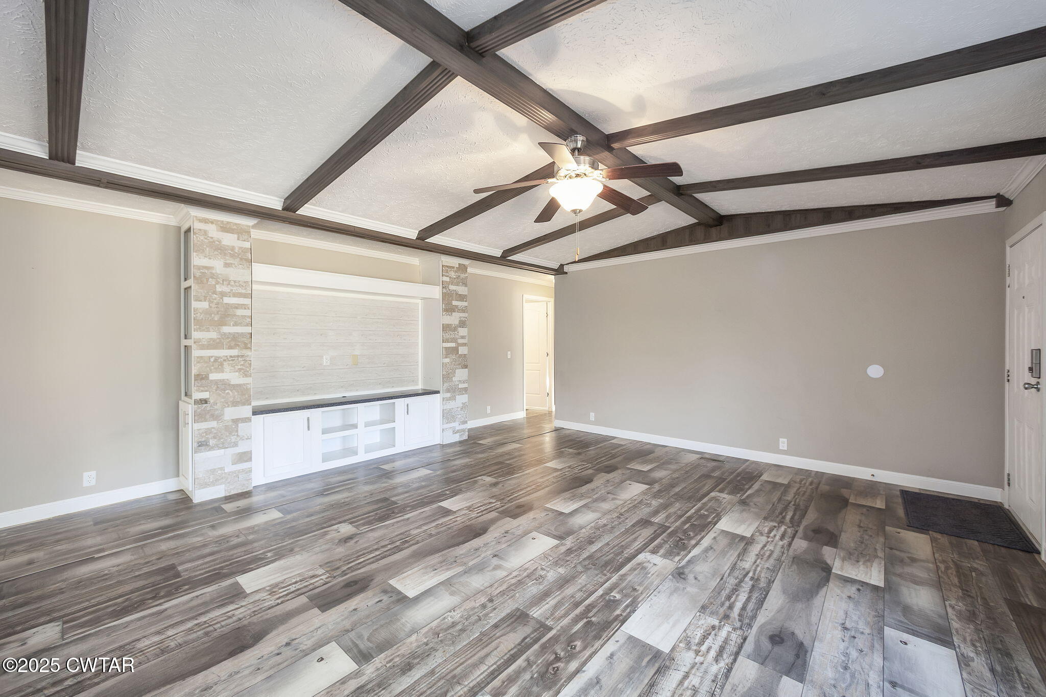 527 John Brown Road Beech Bluff, TN 38313 - Photo 7 of 28 a view of empty room with wooden floor and fan