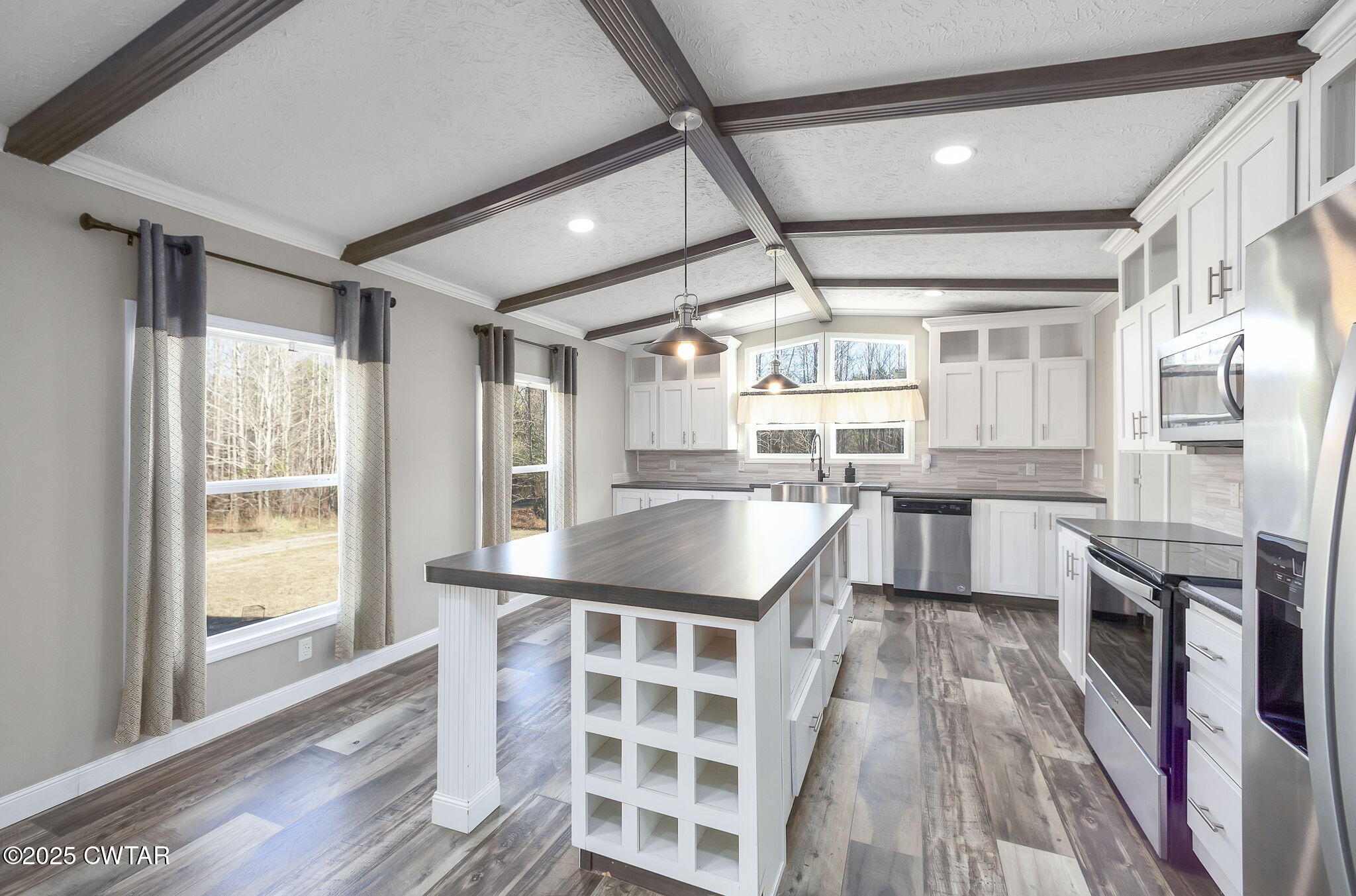 527 John Brown Road Beech Bluff, TN 38313 - Photo 9 of 28 a kitchen with granite countertop a sink a counter space appliances and cabinets
