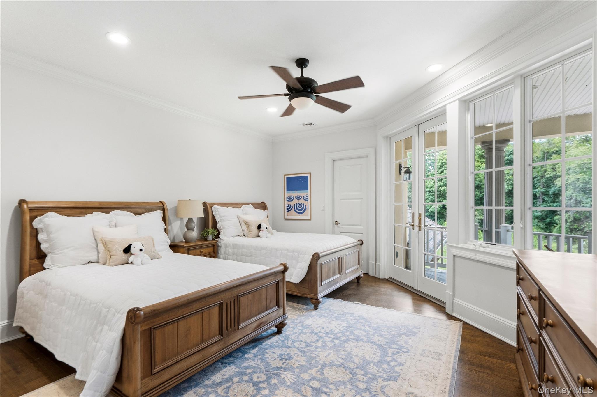 1960 Midlane Road South Syosset, NY 11791 - Photo 41 of 46 a spacious bedroom with a bed and a large window