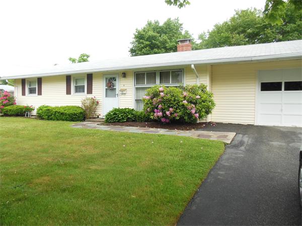 8 Leatherchip Road Holbrook, MA 02343 - Photo 2 of 18 a front view of a house with a garden