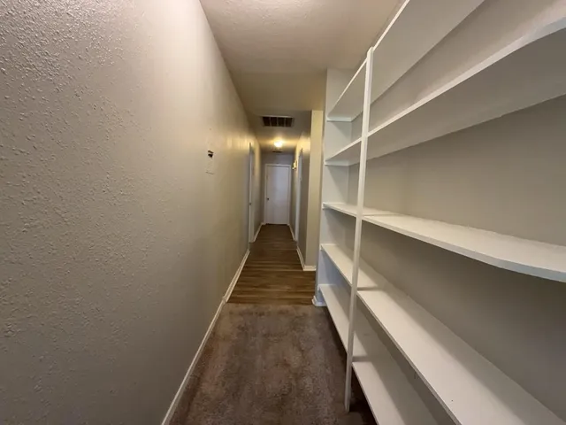 a view of an empty room with a window