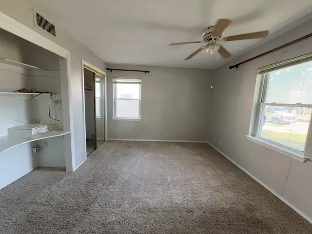 a view of a livingroom with a chandelier and fireplace