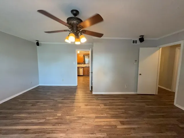 a view of a livingroom with wooden floor