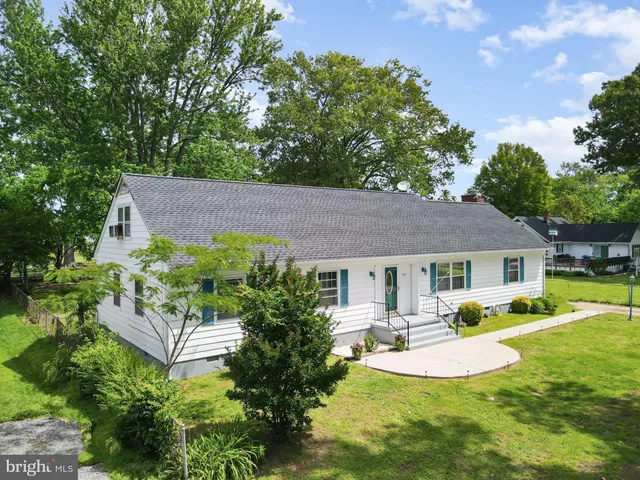 a view of a house with a yard patio and a patio