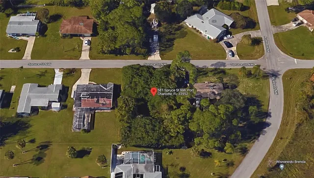 an aerial view of houses with yard