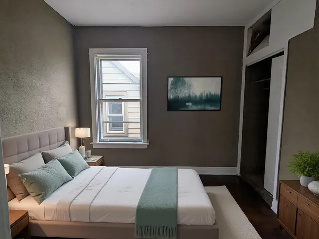 a bedroom with a bed and a window