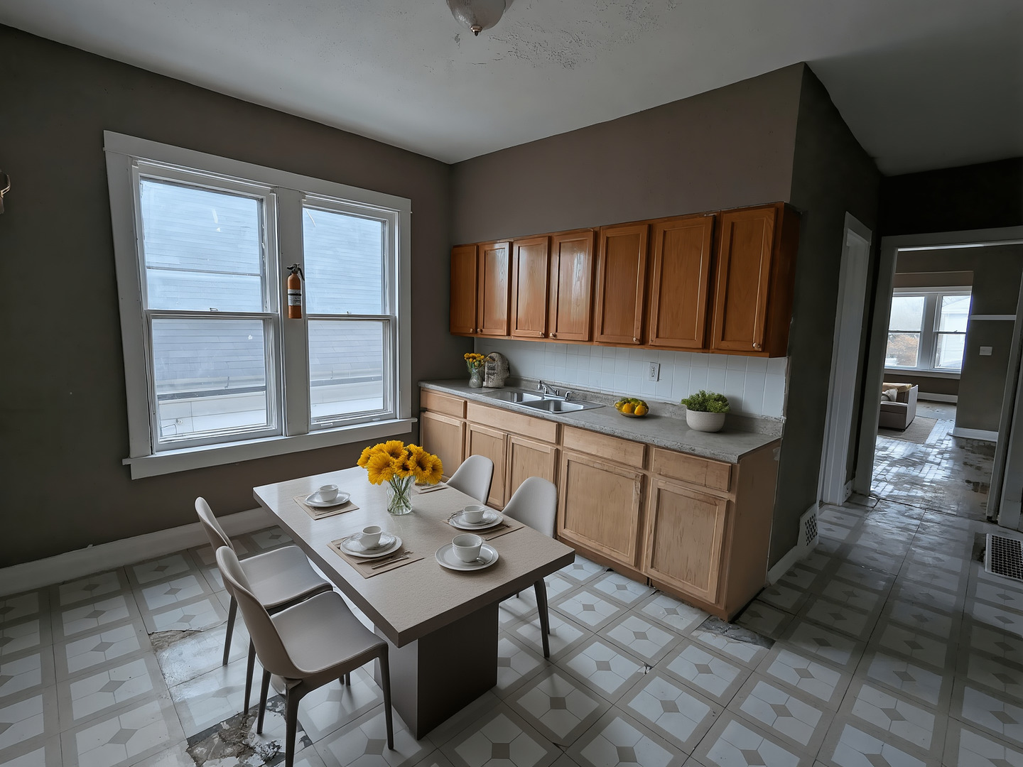 324 West 112th Street Chicago, IL 60628 - Photo 8 of 17 a kitchen with a sink cabinets and window