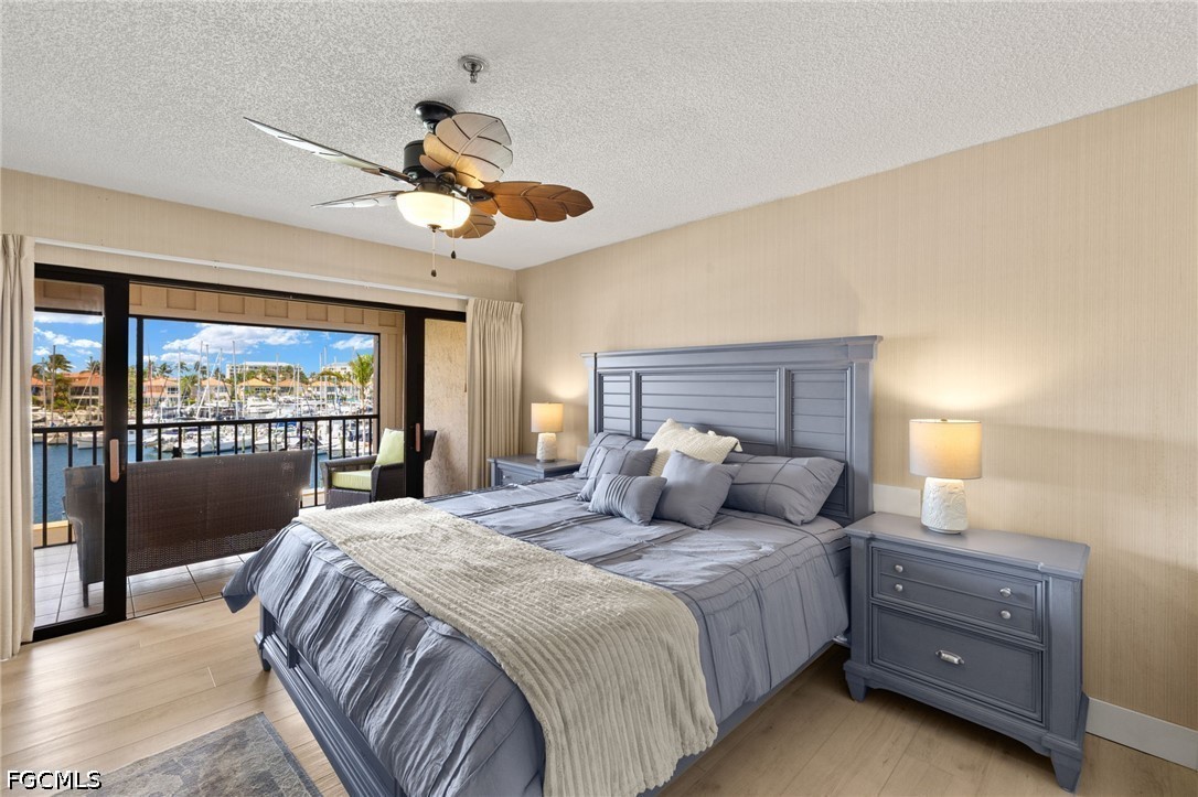 3170 Matecumbe Key Road, Unit 134 Punta Gorda, FL 33955 - Photo 14 of 31 a bedroom with a large bed and a large window