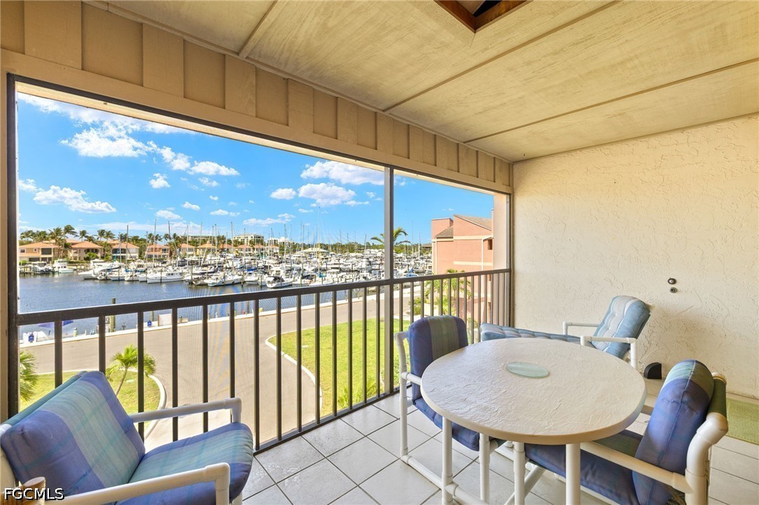 3170 Matecumbe Key Road, Unit 134 Punta Gorda, FL 33955 - Photo 21 of 31 a view of a chairs and table in the balcony