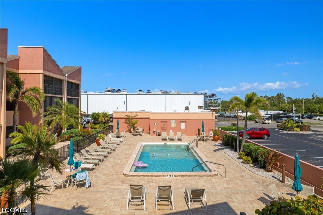 3170 Matecumbe Key Road, Unit 134 Punta Gorda, FL 33955 - Photo 30 of 31 a view of a balcony with chairs