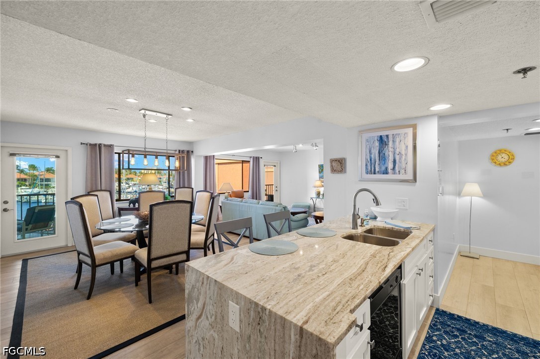 3170 Matecumbe Key Road, Unit 134 Punta Gorda, FL 33955 - Photo 9 of 31 a view of a dining room with furniture