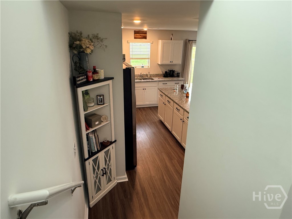 1244 Wilkins Road Midway, GA 31320 - Photo 27 of 58 Stairwell Looking Towards kitchen