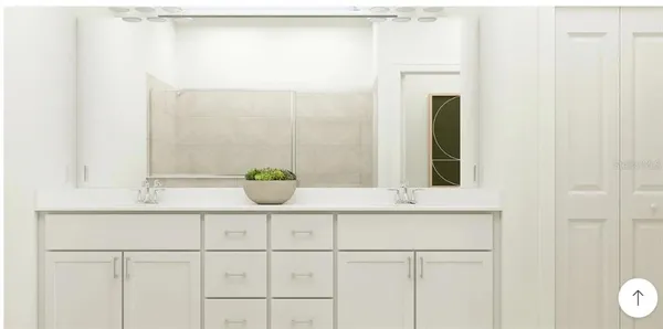 a bathroom with a sink and mirror