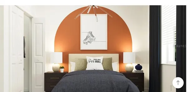 a picture of a bedroom with a bed and a window