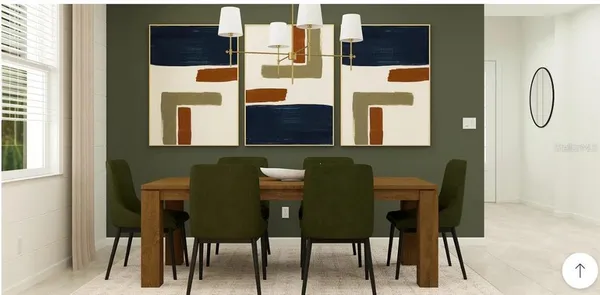 a view of a dining room with furniture and chandelier