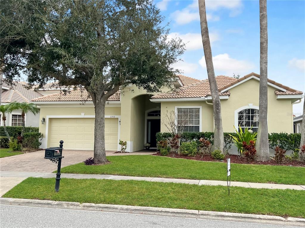 11531 Vicolo Loop Windermere, FL 34786 - Photo 32 of 32 a house view with a garden space