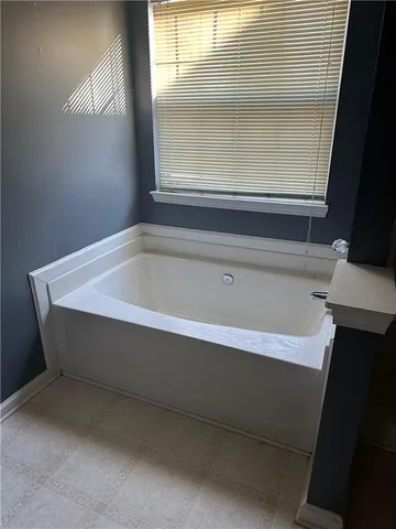 a bathroom with bathtub