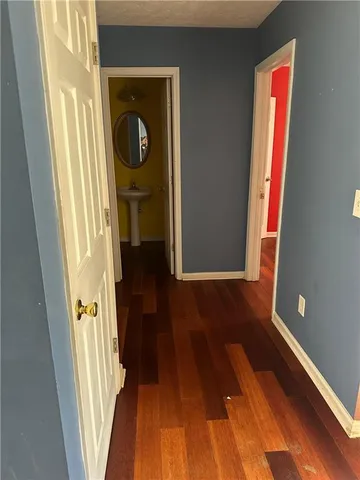a view of front door with wooden floor