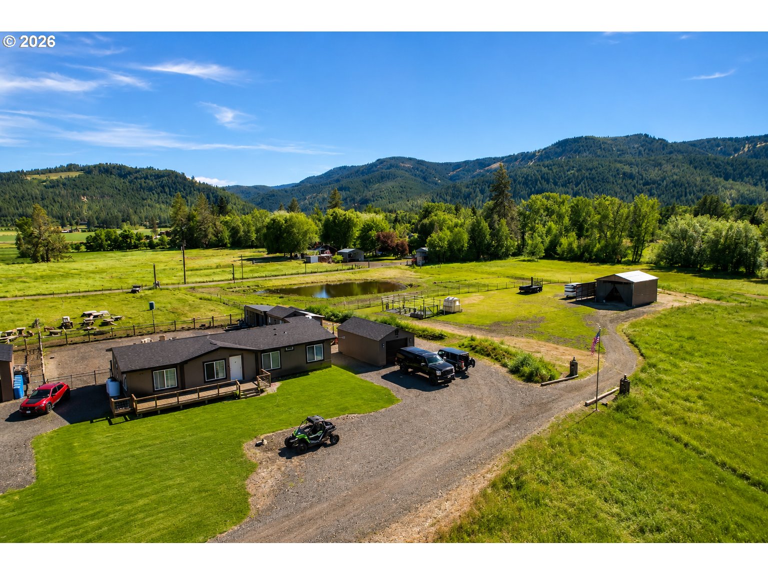 70724 Bear Creek Road Wallowa, OR 97885 - Photo 1 of 44 a view of a city with mountains in the background
