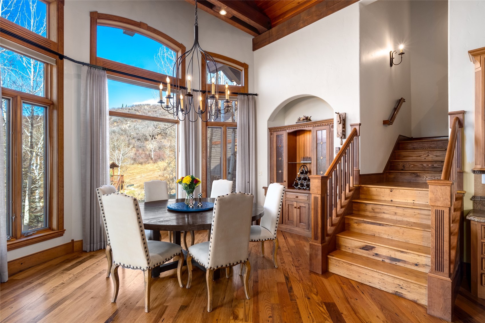 35415 Priest Creek Road Steamboat Springs, CO 80487 - Photo 13 of 50 a dining room with furniture front door and wooden floor