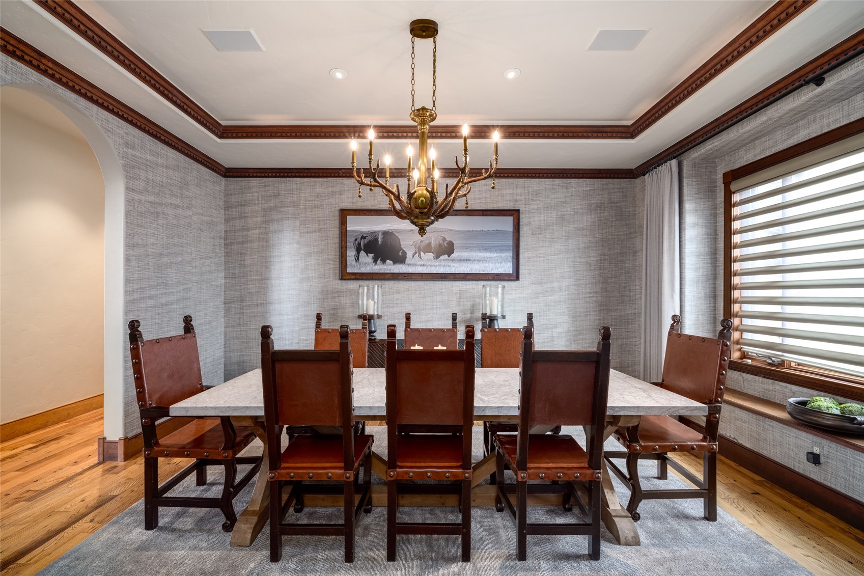 35415 Priest Creek Road Steamboat Springs, CO 80487 - Photo 17 of 50 a view of a dining room with furniture wooden floor and chandelier