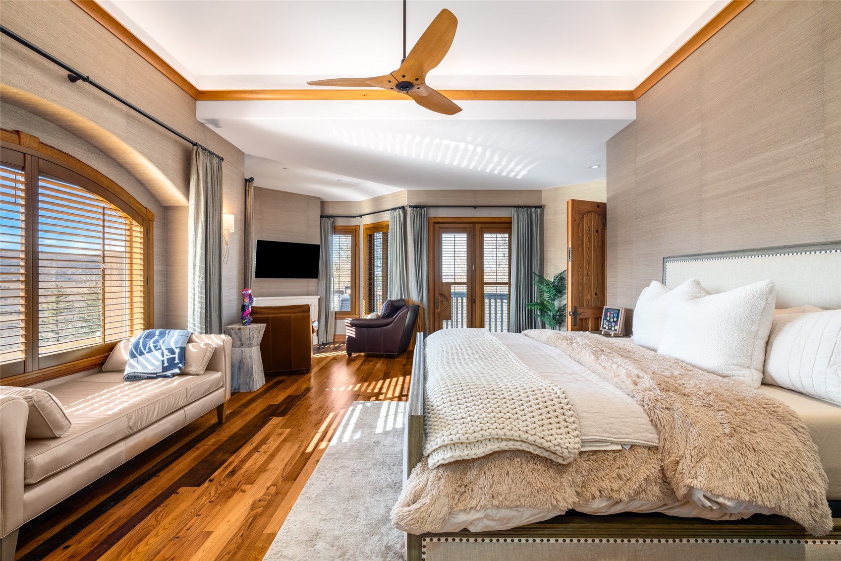 35415 Priest Creek Road Steamboat Springs, CO 80487 - Photo 19 of 50 a bedroom with a bed couch and large windows