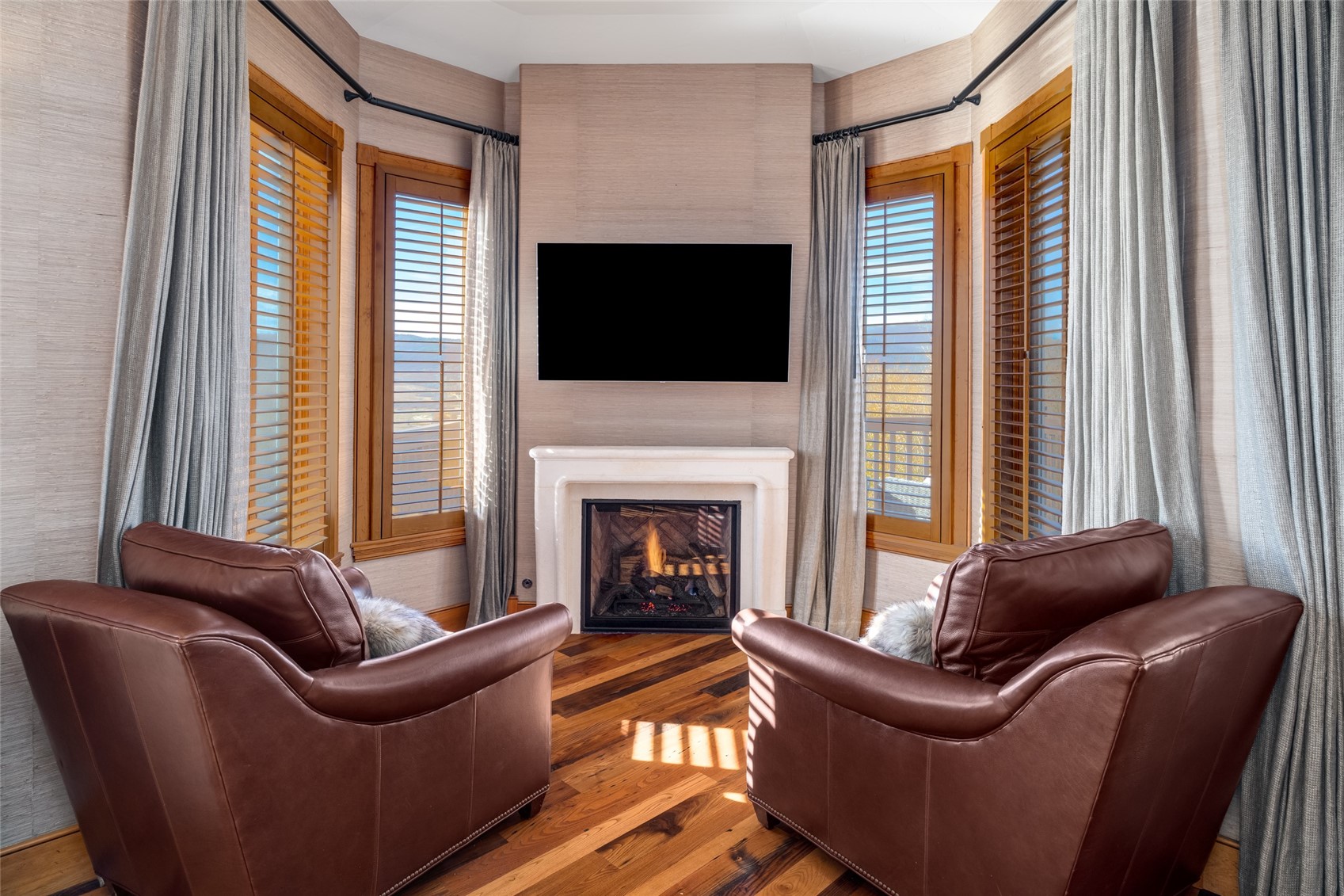 35415 Priest Creek Road Steamboat Springs, CO 80487 - Photo 20 of 50 a living room with furniture and a fireplace