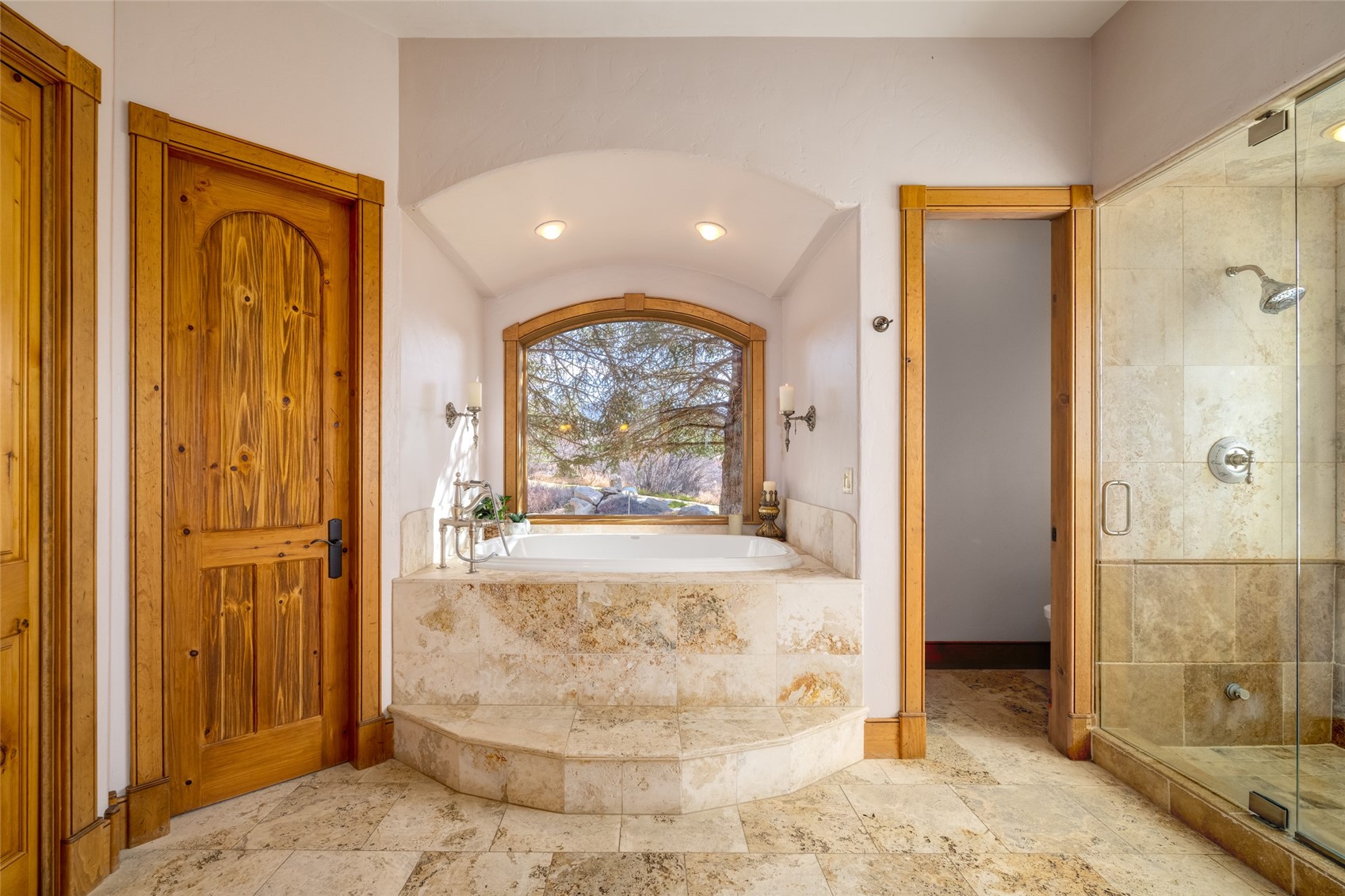 35415 Priest Creek Road Steamboat Springs, CO 80487 - Photo 23 of 50 a view of a hallway with wooden floor and a bathroom