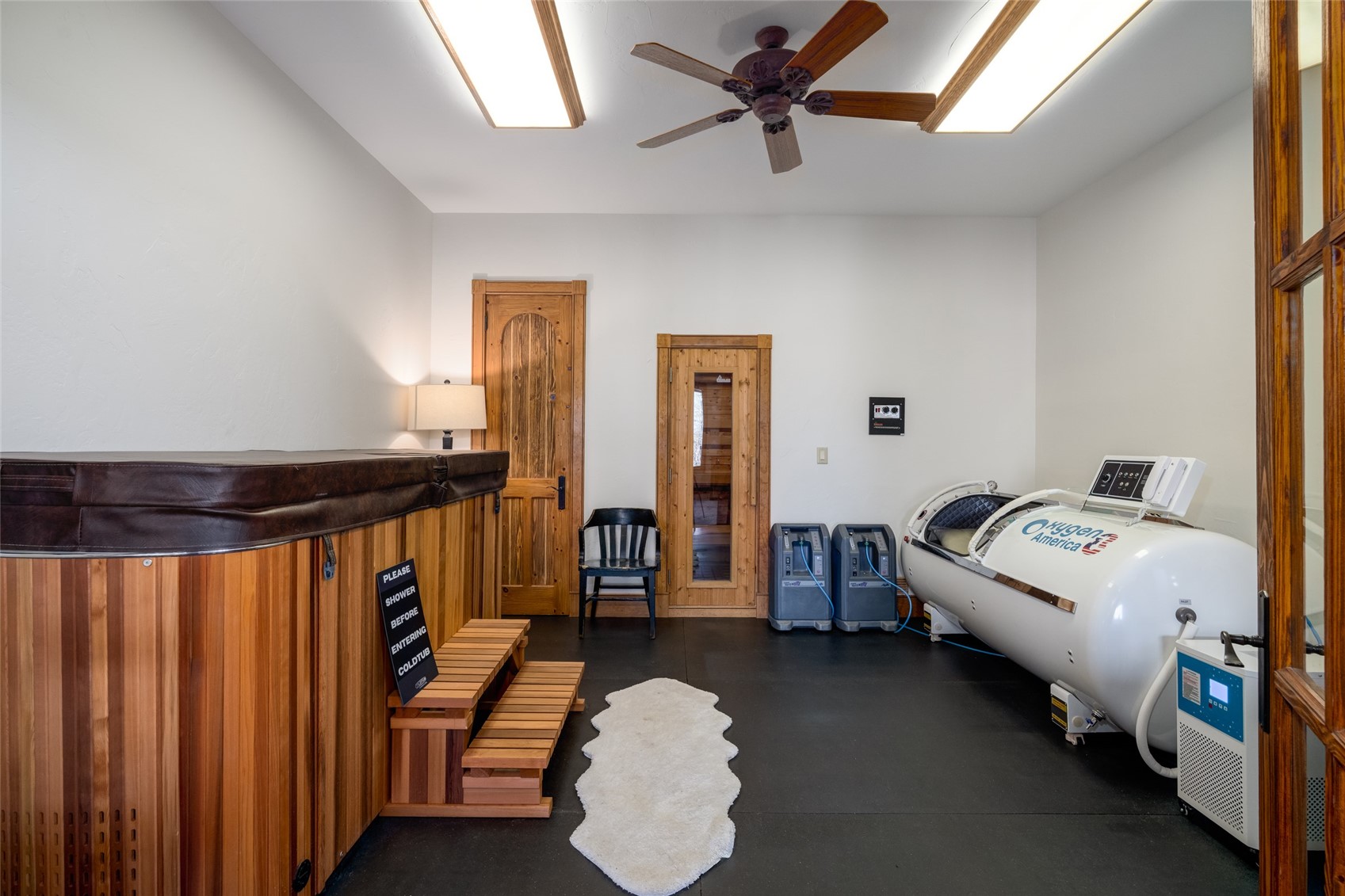 35415 Priest Creek Road Steamboat Springs, CO 80487 - Photo 28 of 50 a bedroom with bed and a chandelier